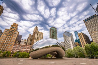 CHICAGO - ILLINOIS: MAY 9, 2018: Cloud Gate in Millennium Park under stormy skies. clipart