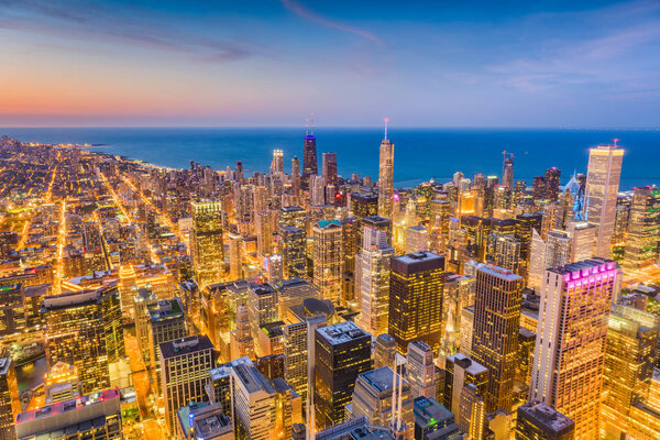 Chicago, Illinois, USA skyline from above with Lake Michigan at dusk.