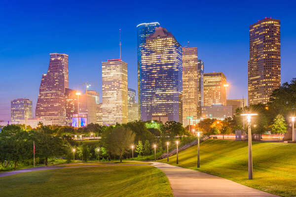 Houston, Texas, USA skyline and park at dusk.
