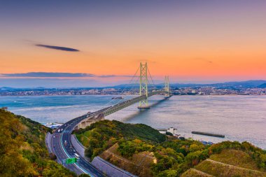Awaji Island, Japan view of the Akashi Kaikyo Ohashi Bridge spanning the Seto Inland Sea to Kobe. clipart