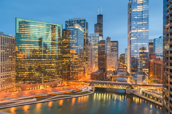 Chicago, Illinois USA skyline over the river twilight.