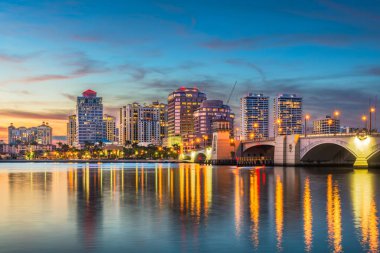 West Palm Beach, Florida, USA skyline on the Intracoastal Waterway at twilight. clipart