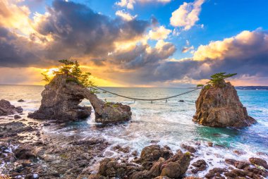 Noto Peninsula, Ishikawa, Japan at the Hatago Iwa Rock during sunset. clipart