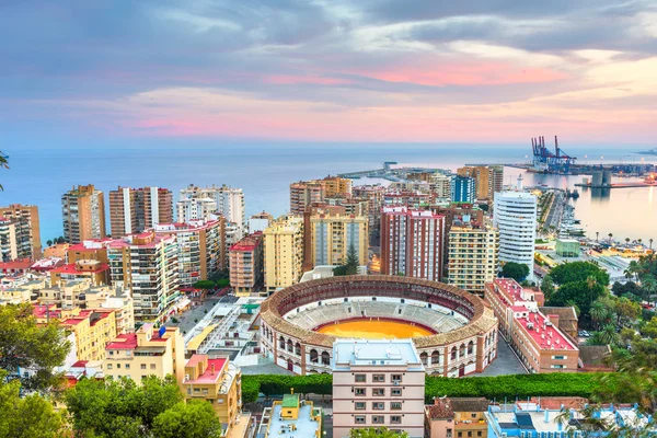 Malaga, Spain dawn skyline towards the Mediterranean Sea. — Stock Photo, Image