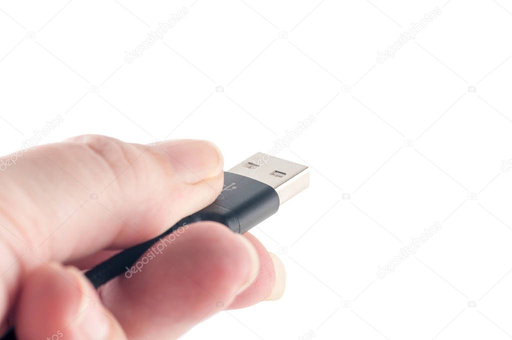 USB cable in the hands, isolated, closeup