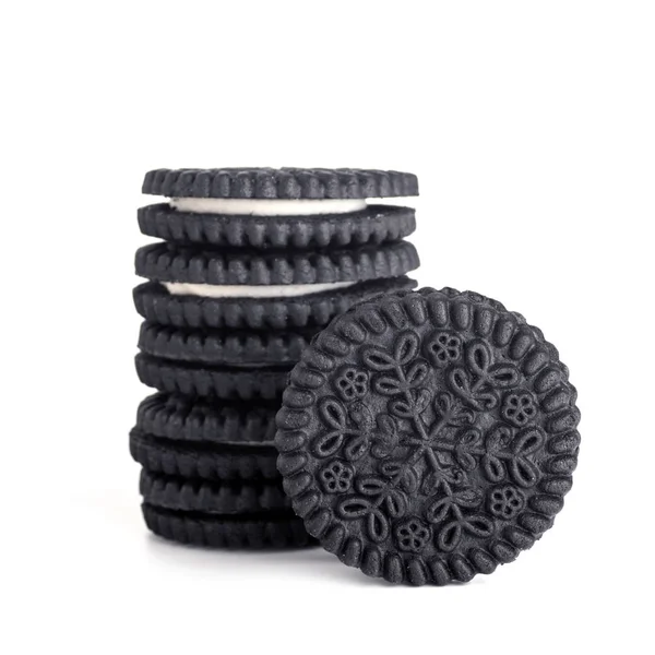 Black cookies with white filling isolated — Stock Photo, Image