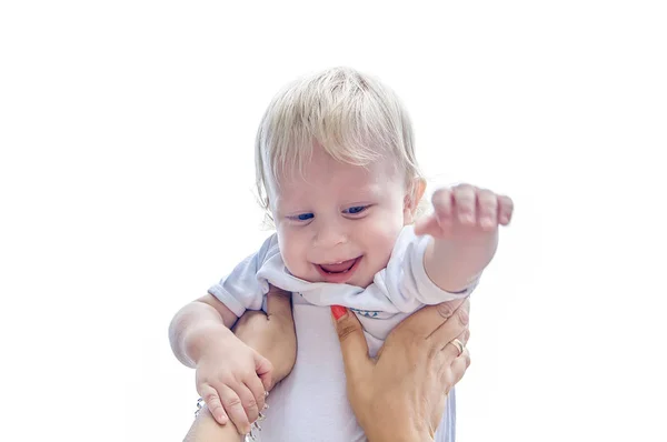 Mom raises up laughing baby, on a white background — Stock Photo, Image