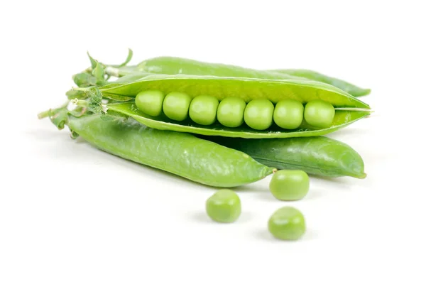 Green peas in pods on a white background — Stock Photo, Image