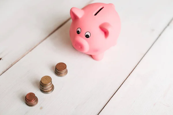 Little Cute Pink Pig Piggy Bank Wooden Table Three Piles — Stock Photo, Image