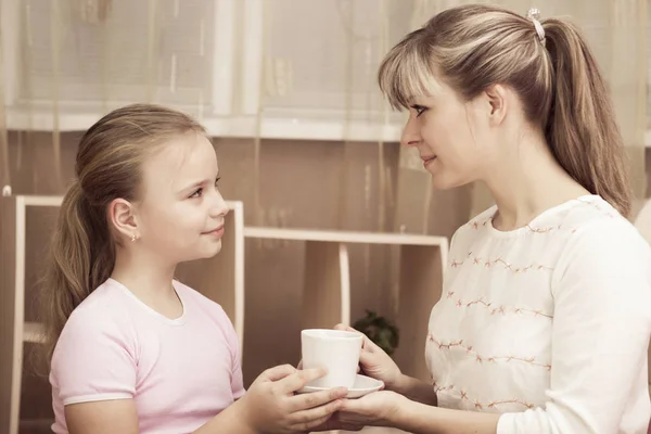 Loving Daughter Treating Her Mother Mug Coffee — Stock Photo, Image