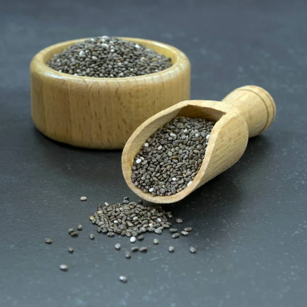 Close Chia Seeds Wooden Bowl Scoop Dark Stone Surface — Stock Photo, Image