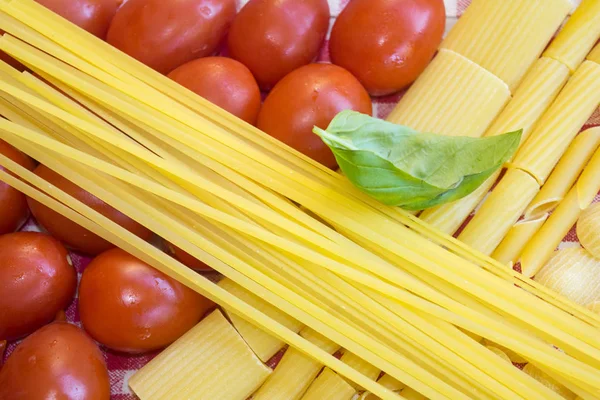 Raw Assorted Pasta Fresh Tomatoes Basil — Stock Photo, Image