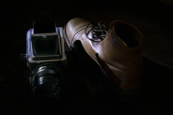 old boot and camera of others times