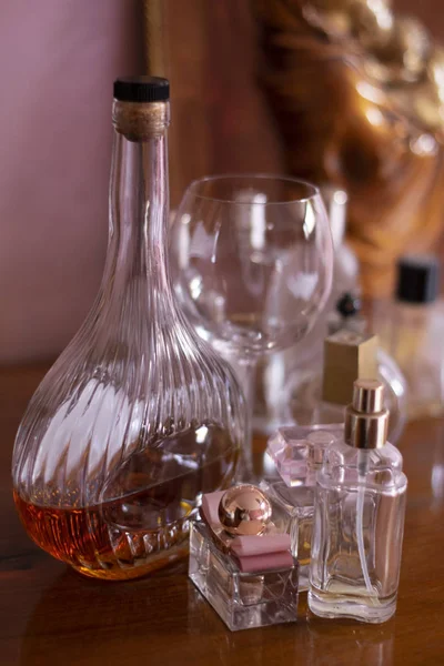 Cognac bottle and wineglass — Stock Photo, Image