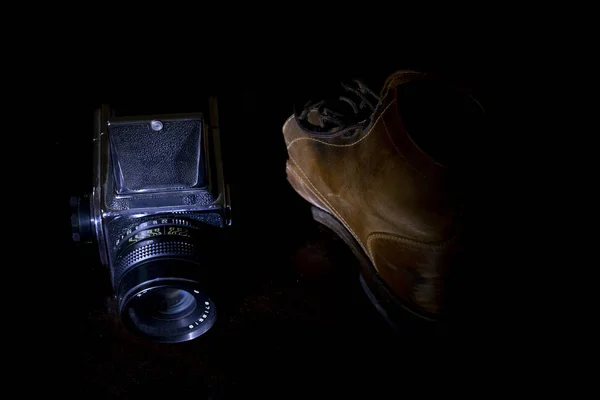 old boot and camera of others times