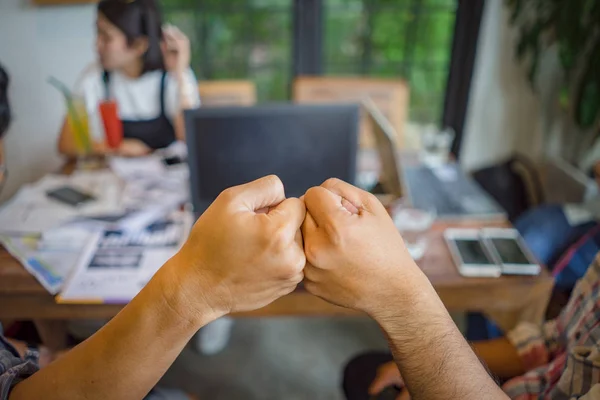 colleagues fist bump finish up office meeting. Mission complete, teamwork power, partnership support trust  Corporate people successful agreement deal. Business partner fist bump handshake together.