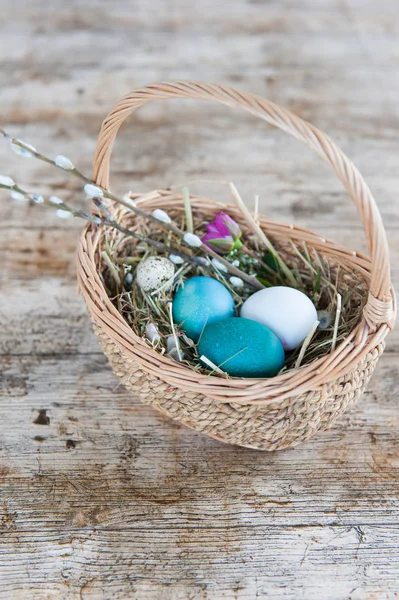 Wicker Basket Painted Easter Eggs Wooden Background — Stock Photo, Image