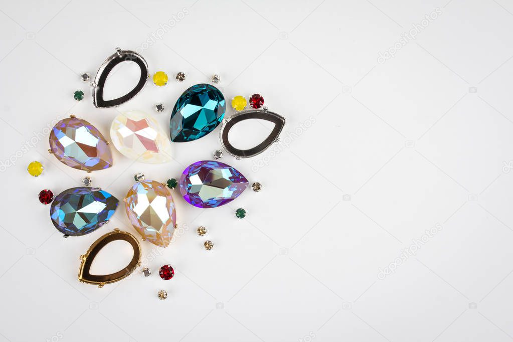 Gemstones crystals for jewelry scattered on white background. Toning.