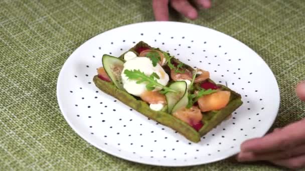 Freshly baked green Viennese waffle filled with poached egg — Stock Video