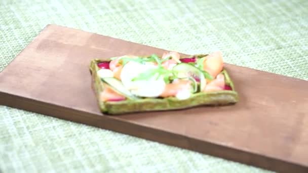 Freshly baked green Viennese waffle filled with poached egg — Stock Video