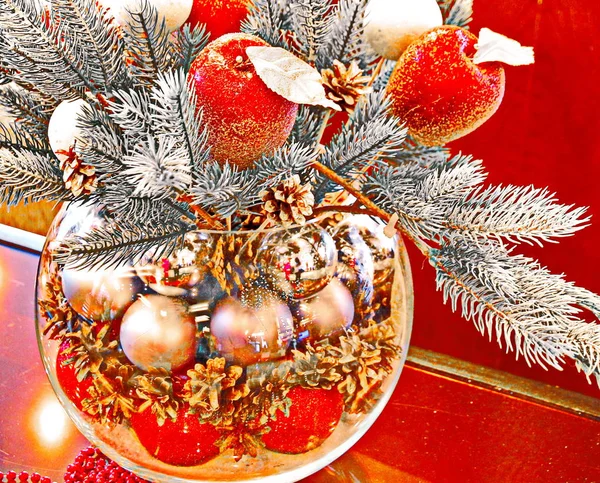 Christmas holidays composition with red apples and glass vase — Stock Photo, Image