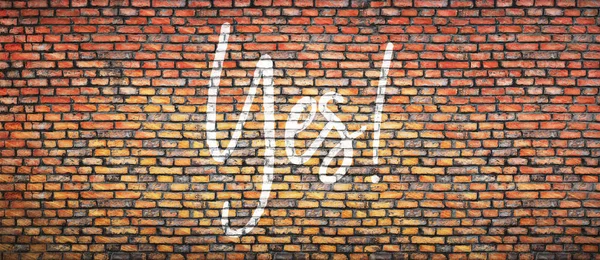 Brick wall with word yes. Concept background