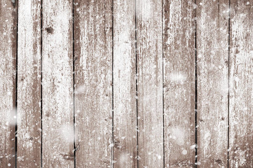 Grunge wood planks with snow flakes falling on. Christmas background