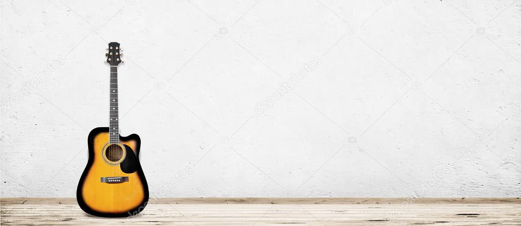 Guitar in empty vintage room with white wall background