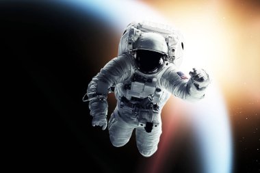 Uzayda bir astronot. Bu görüntünün elementleri NASA tarafından desteklenmektedir