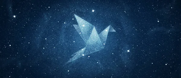 Stars in origami bird shape over blue night sky background