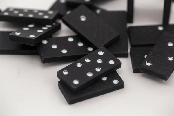 the game is in black dominoes on white background