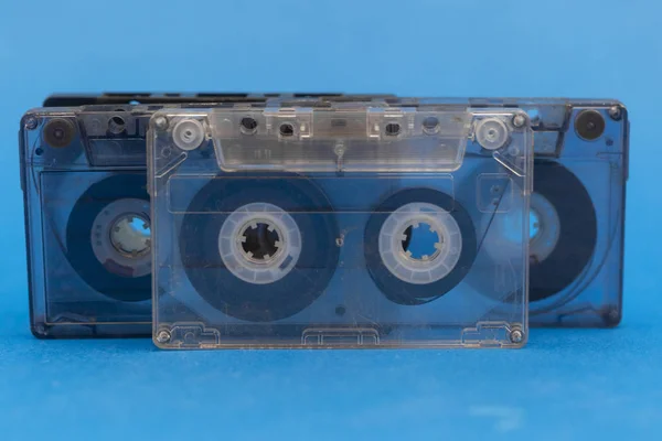 old audio cassettes on a blue background