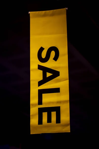 sale sign on shop Windows