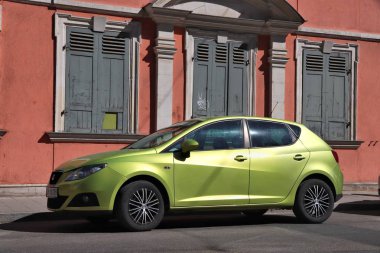 ERLANGEN, GERMANY - MAY 6, 2018: Green Seat Ibiza compact hatchback car parked in Germany. There were 45.8 million cars registered in Germany (as of 2017). clipart