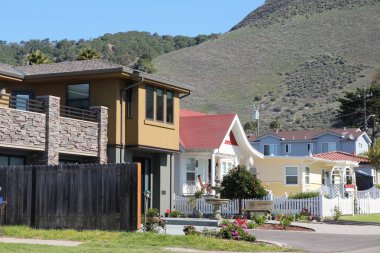 CALIFORNIA, UNITED STATES - APRIL 7, 2014: Generic California residential homes as seen from public road in San Luis Obispo county. Real estate rates in California have grown 105 percent since 1990. clipart