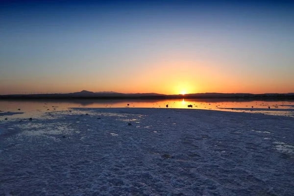 Cyprus landscape - Larnaca salt lake. Ground covered in white salt.