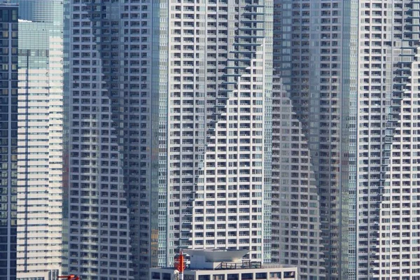 Massive apartment buildings - high density residential architecture of Kachidoki area in Tokyo.