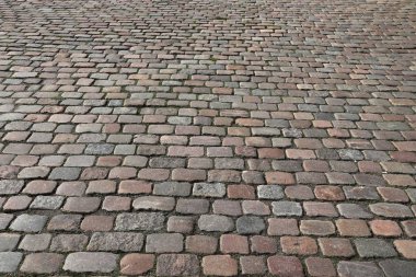 İsveç Göteborg 'da taş kaldırım döşeme arkaplanı granit kaldırım taşı deseni.