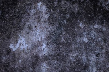 Karanlık, kaba bir arka plan. Koyu renk. Tuhaf bir doku..