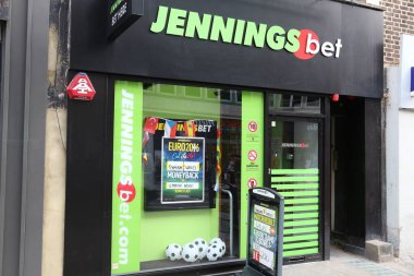 LONDON, UK - JULY 7, 2016: Sports betting shop Jennings Bet in London. Jennings Bet has 100 bookmaker stores in the UK. clipart