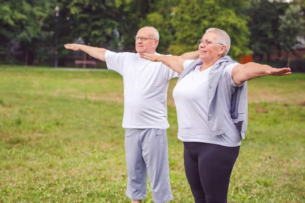 Smiling Senior Couple Outdoors Park Exercise Dumbbells Having Fun Together — Stock Photo, Image