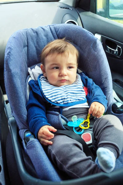 Baby boy in safety car seat with safety belt locked protection — Stock Photo, Image