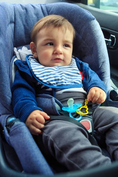 Boy in safety car seat with safety belt locked protection — Stock Photo, Image