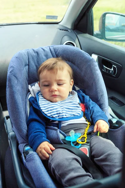 Baby car seat for safety. baby boy in safety car seat with safety belt locked protection. — Stock Photo, Image