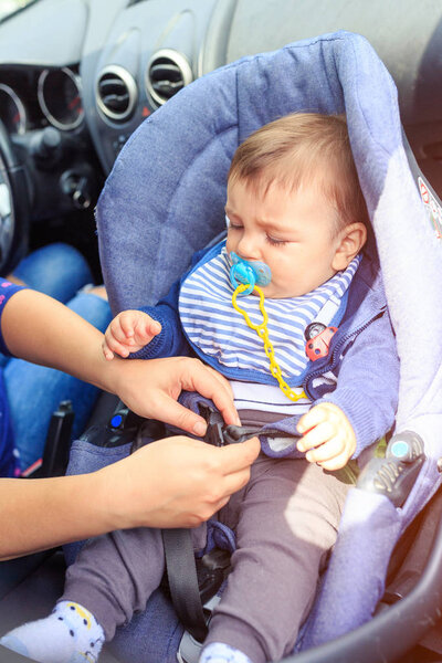 children car chair. baby car seat for safety. Protection in the car.Mother and child boy in car. Safety driving concept 