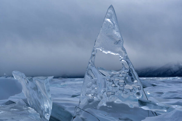 Endless blue ice hummocks in winter on the frozen Lake Baikal