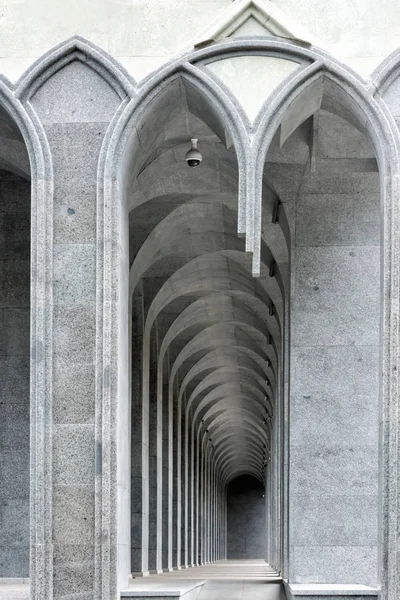 Curvilinear arch niche sitting places in black and white. Digitally reworked close-up photo of architectural fragment with stair-step structure. — Stock Photo, Image