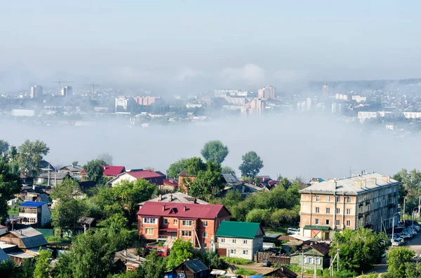 IRKUTSK, RUSSIA - July 8, 2013: Panoramic top view the city of Irkutsk on sunny summer day with fog — Stock Photo, Image