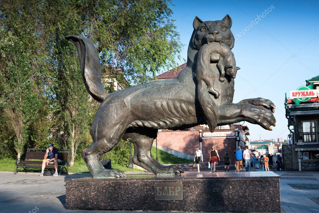 IRKUTSK, RUSSIA - JULY 7, 2019: Babr Sculpture siberian tiger symbol of Irkutsk city in summer sunny day
