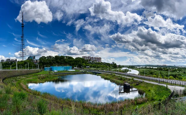 Panoramic view to Irkutsk city, small pond with reflection, TV tower and road from the academic bridge in sunny summer day with beautiful clouds — Stock Photo, Image